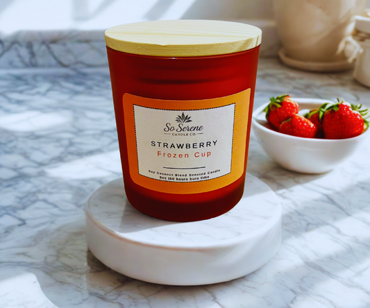 Strawberry Frozen Cup candle in a clear red glass jar